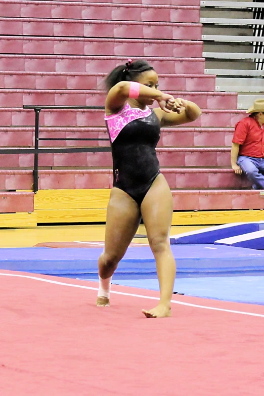 a person standing on a court with a bat