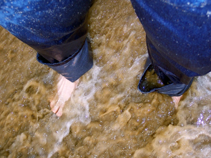 a closeup of a person's foot in the water