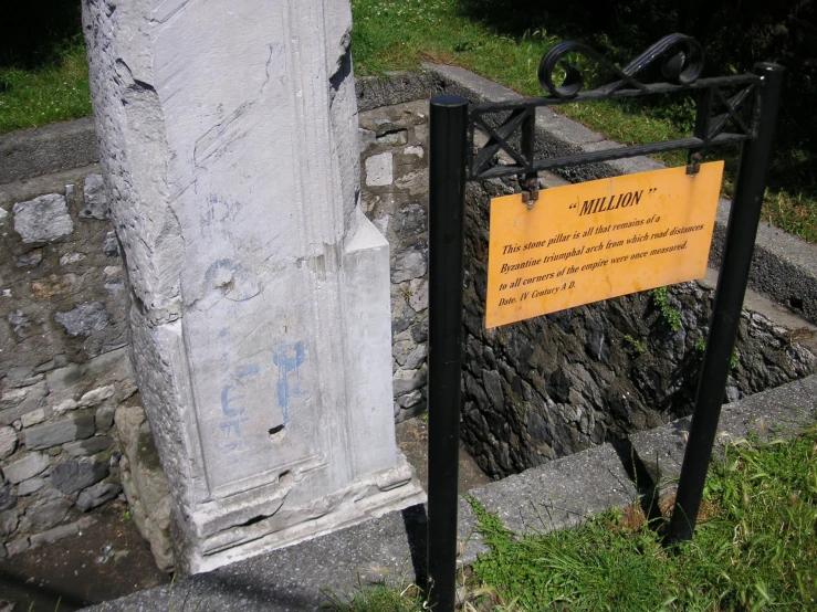 a concrete wall that is part of the cemetery