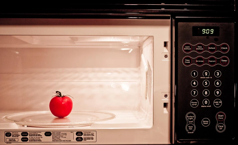 an apple in the microwave with timers on it