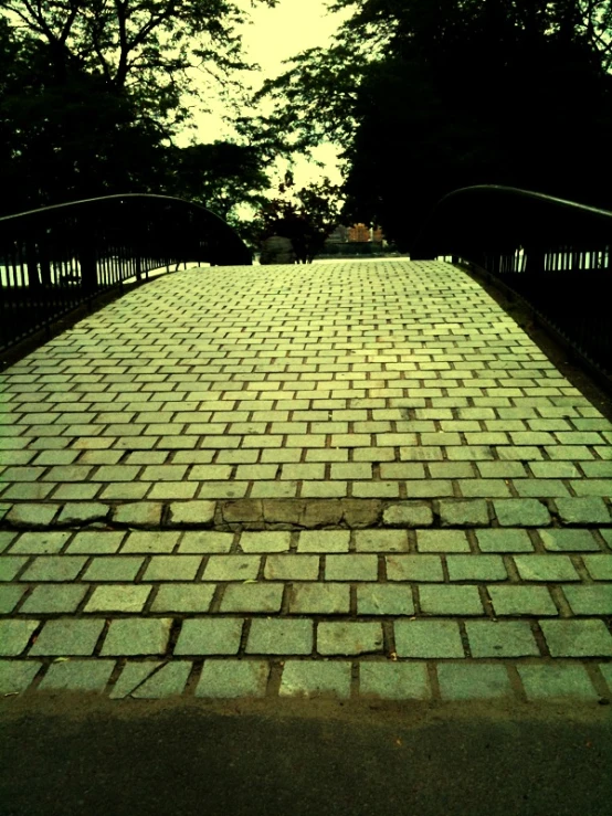 a stone walkway in the evening light