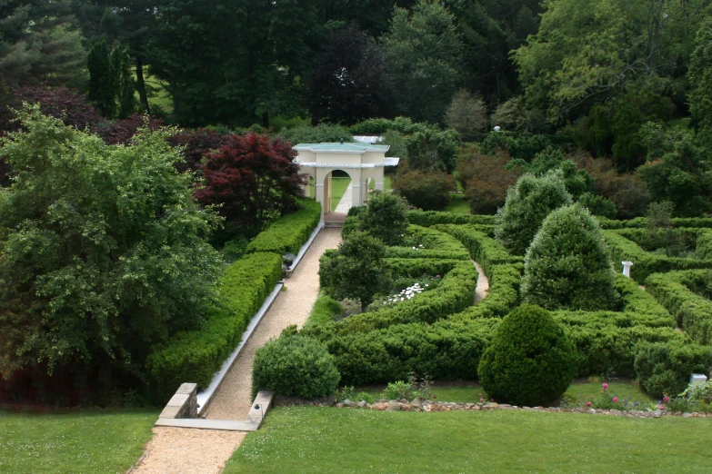 a bench is in the middle of a large garden