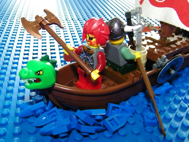 a couple of people in a boat with an angry green creature