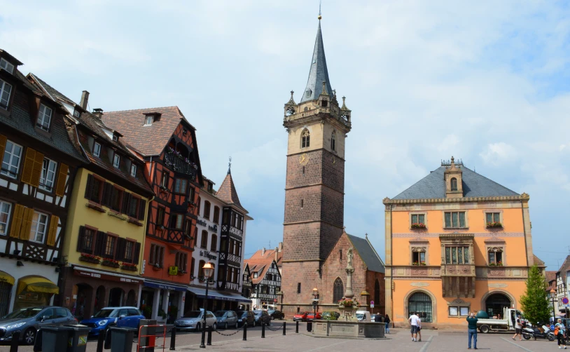 an image of a tall clock tower in the middle of town