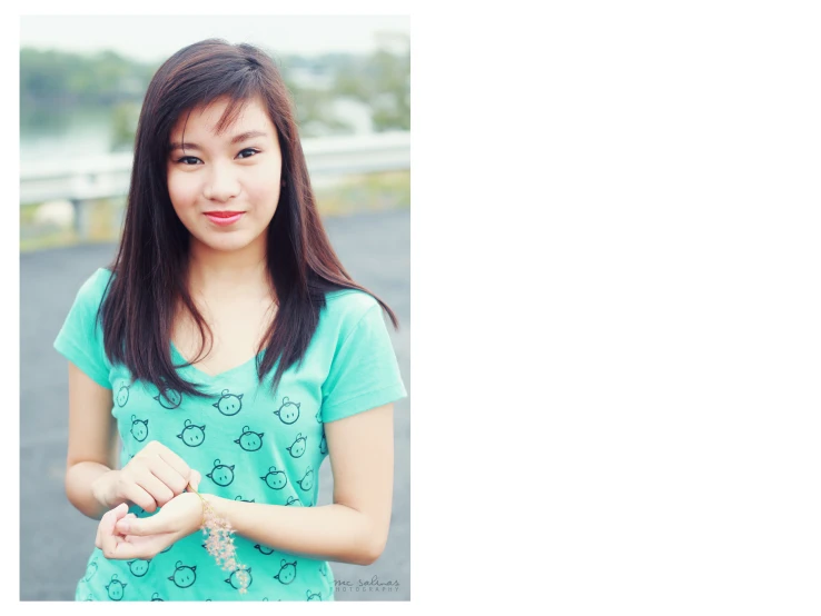 young woman posing in the rain with her hand up to her heart