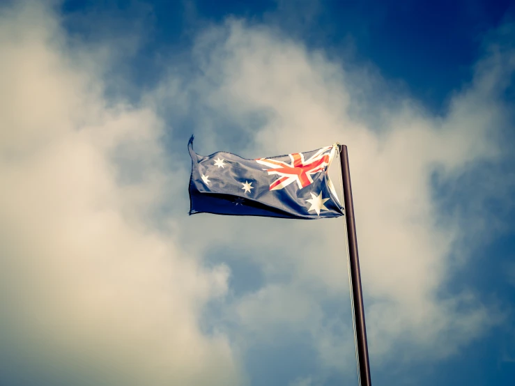 a small flag flying high in the sky