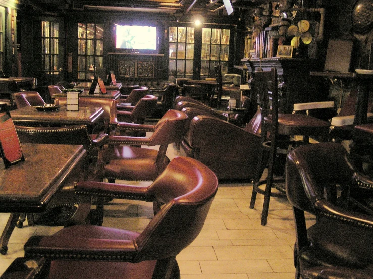 a po of a restaurant with long tables and lots of chairs