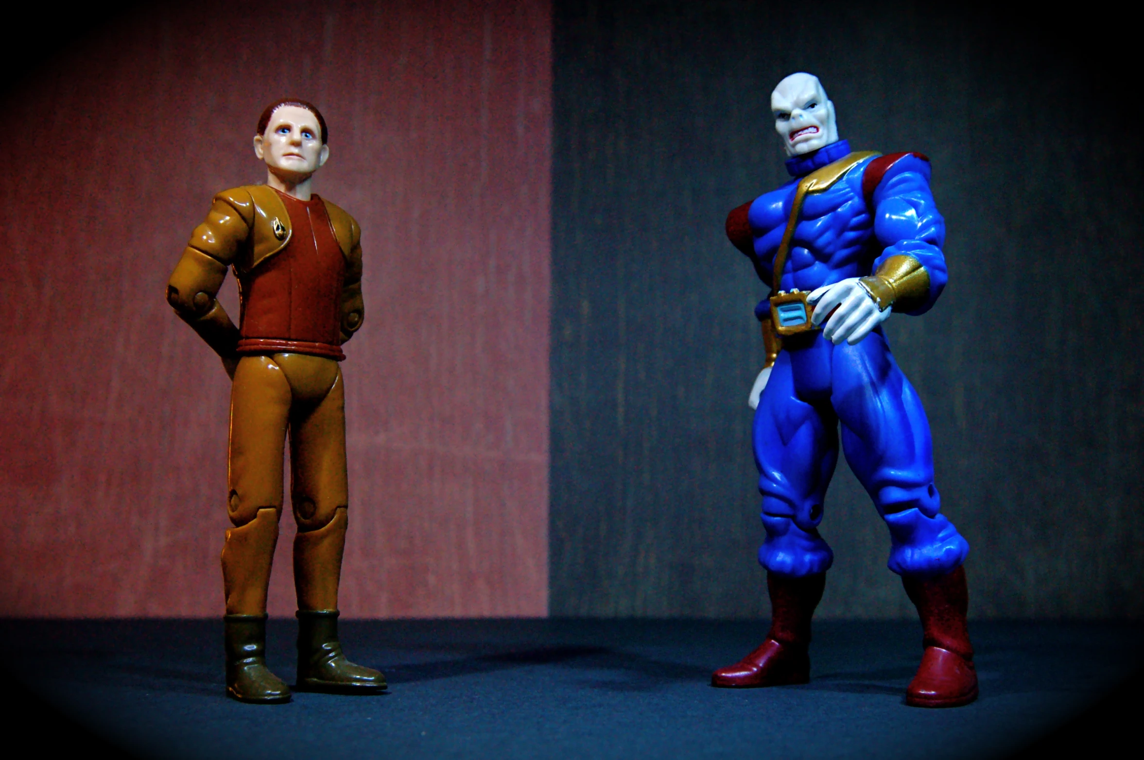 two action figures from different eras stand together