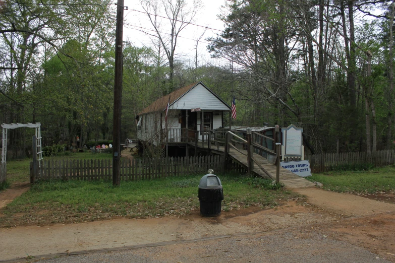 a rustic home is shown with a mailbox