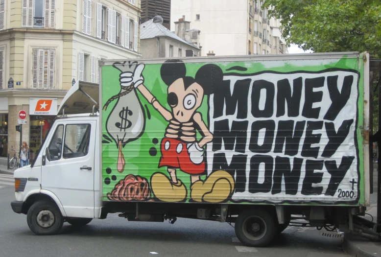 a delivery truck covered with stickers advertising money