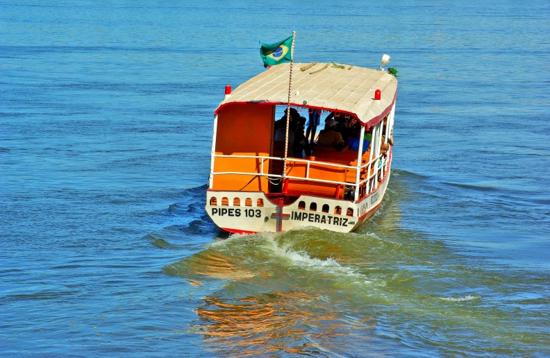 a boat floating through a body of water