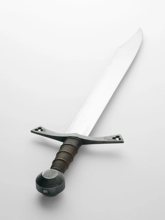 a large knife with a wooden handle, and an odd shaped blade