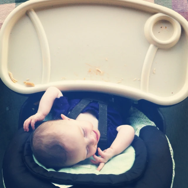 an infant is lying in his stroller