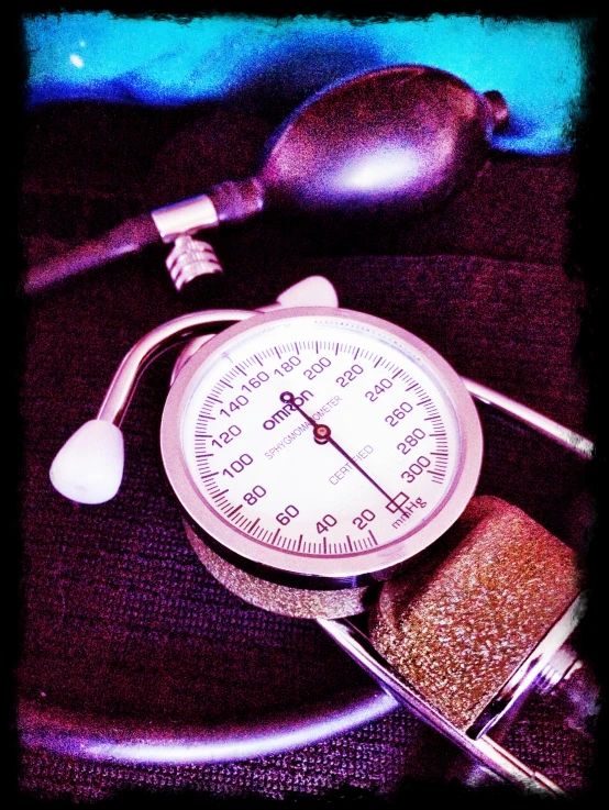 a close - up of a pressure gauge and measuring spoon