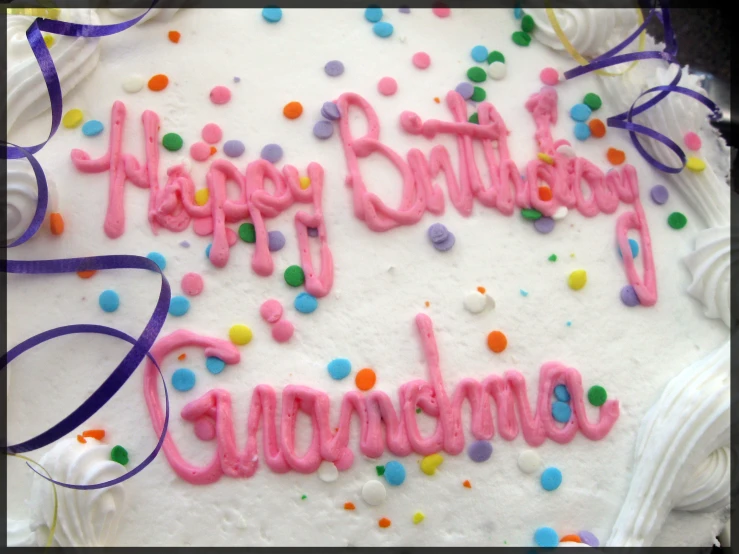 happy birthday cake with confetti and purple frosting