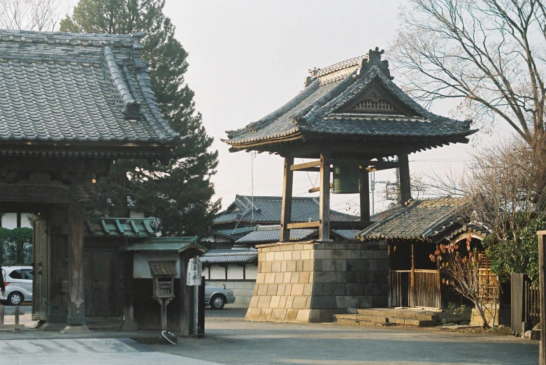 a stone building with a tall bell tower next to it