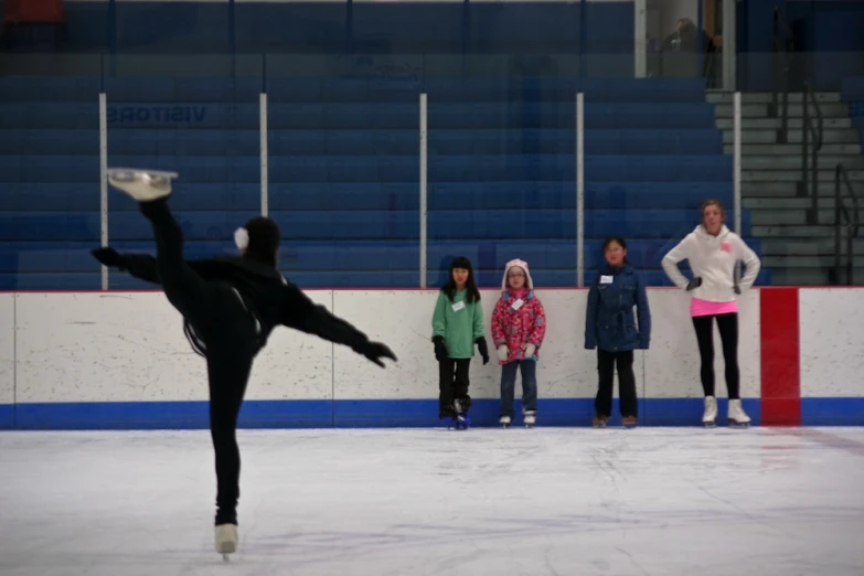 a man on a skateboard doing tricks in an arena