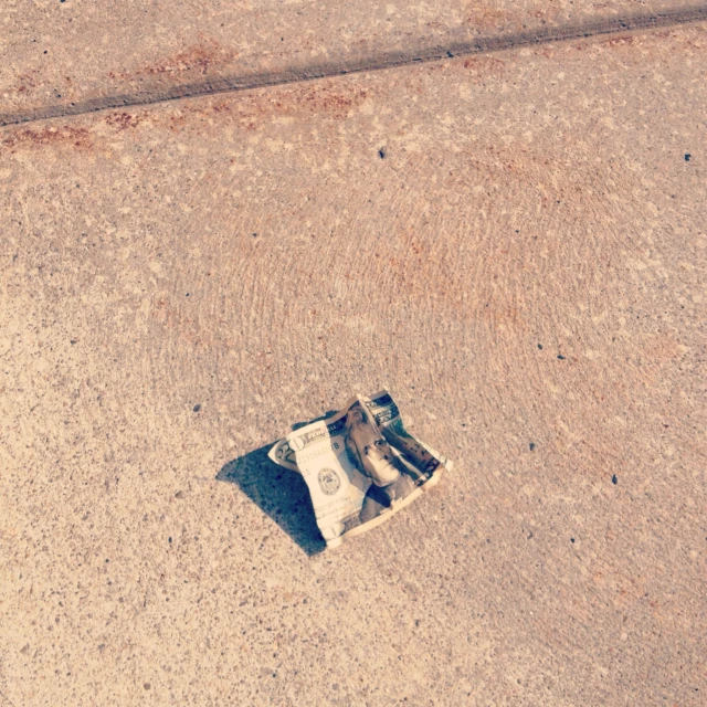 an old newspaper that is laying on the ground