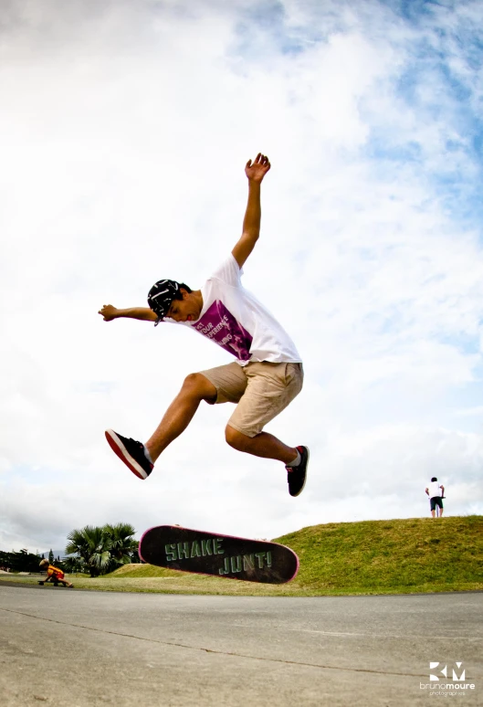 a skateboarder is midair as he balances on his board