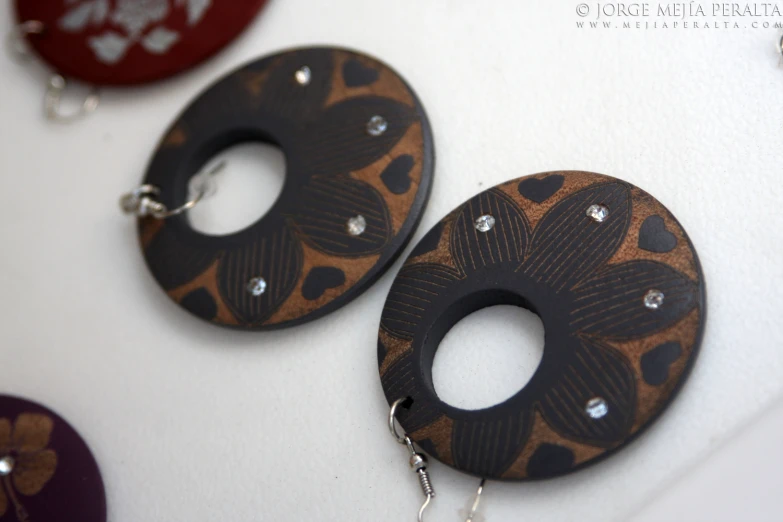 earrings with an intricate pattern on them