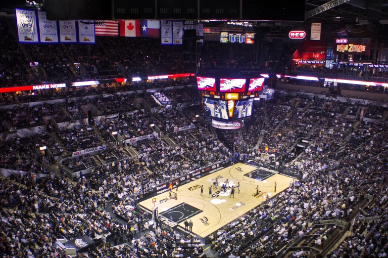 an arena with a basketball game being played