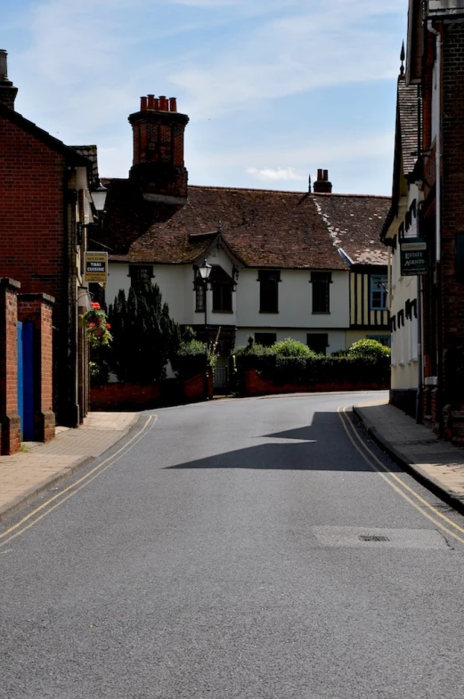 the road in front of a brick building