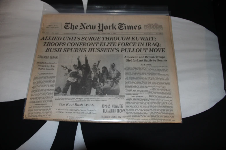 a newspaper cover lying on top of a white table