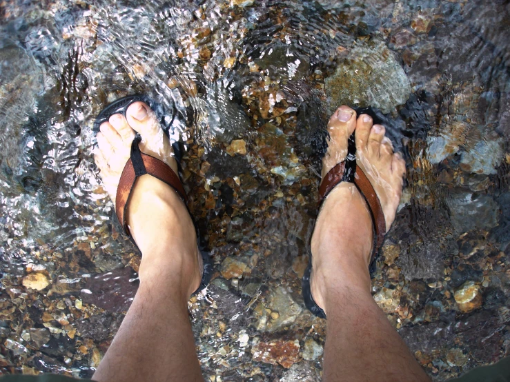 the person is standing in front of the water