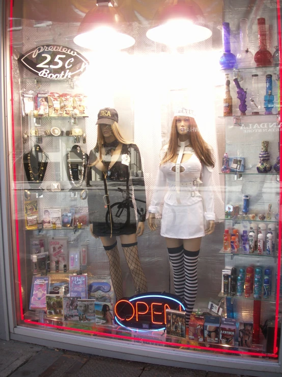 two female mannequins are seen in a window display