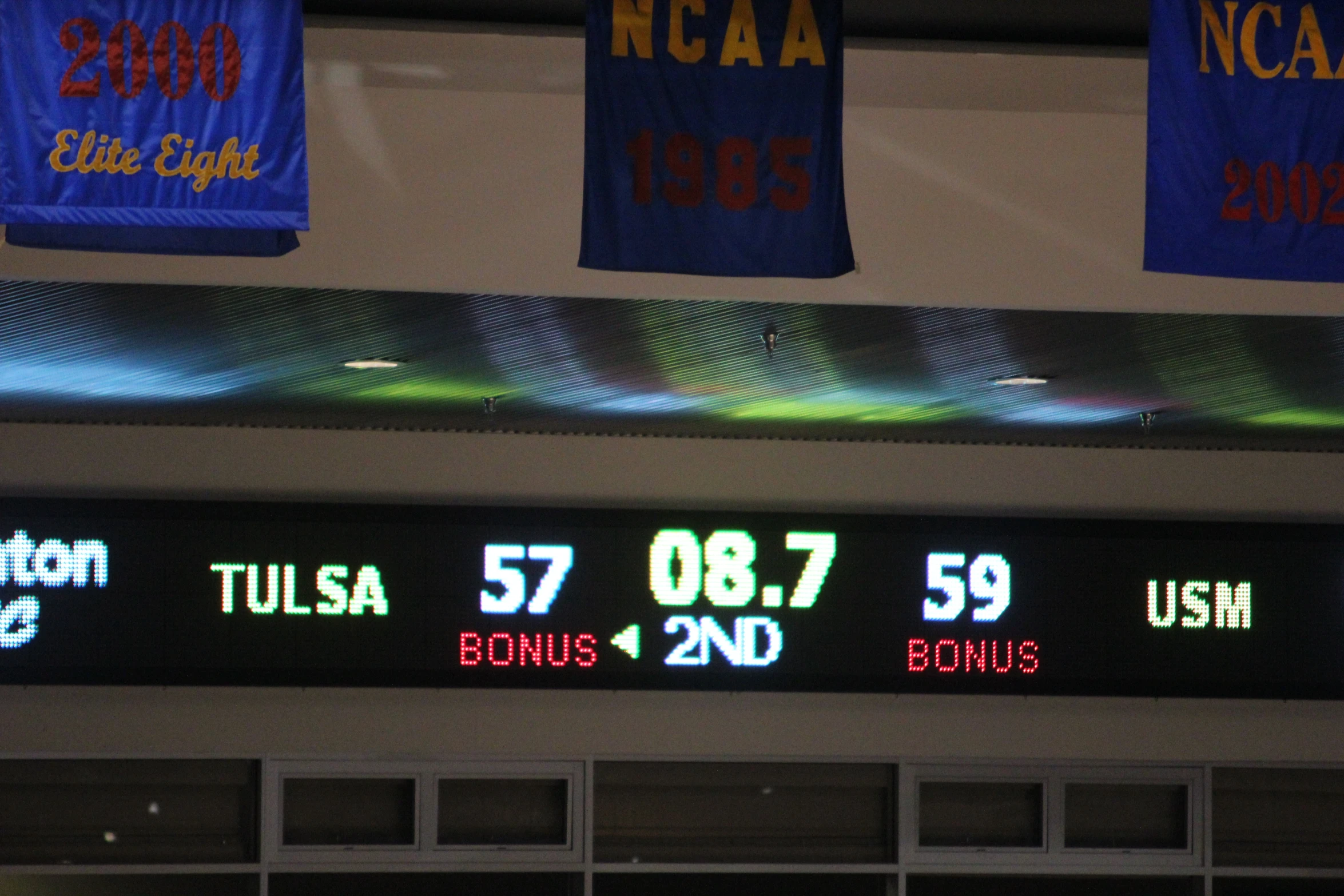 a digital scoreboard with the time on it