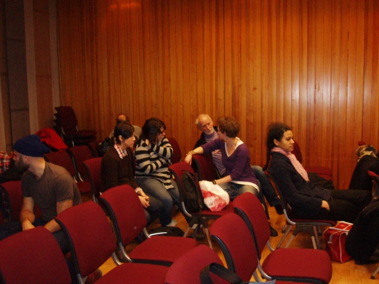 a large group of people sitting in a auditorium
