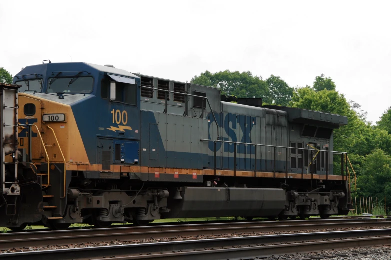 a cargo train is seen moving down the tracks