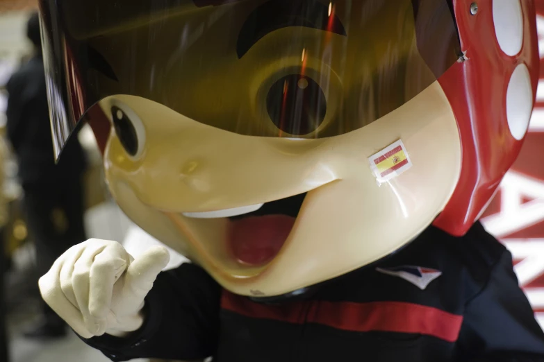 the soccer mascot has it's mouth open and eyes closed