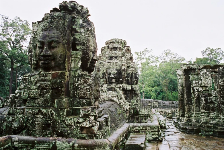 an overview s of several face carved buildings