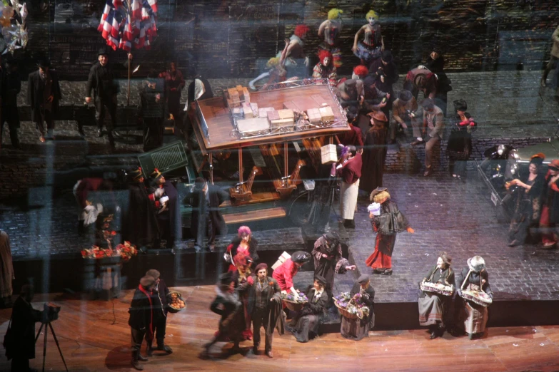 people gathered around the stage for an opera show