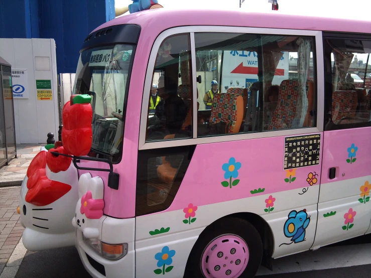 the hello kitty passenger bus is decorated for the summer