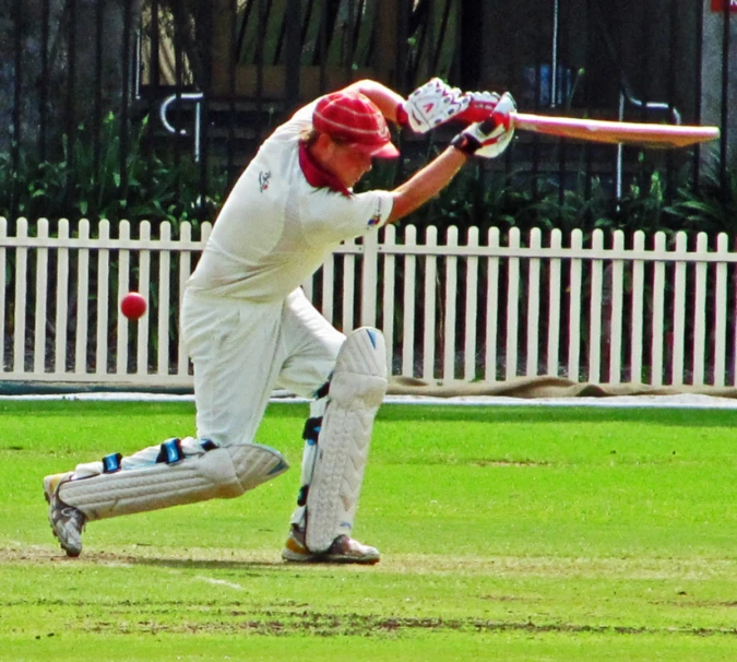 a man holding a bat in his hands on a field