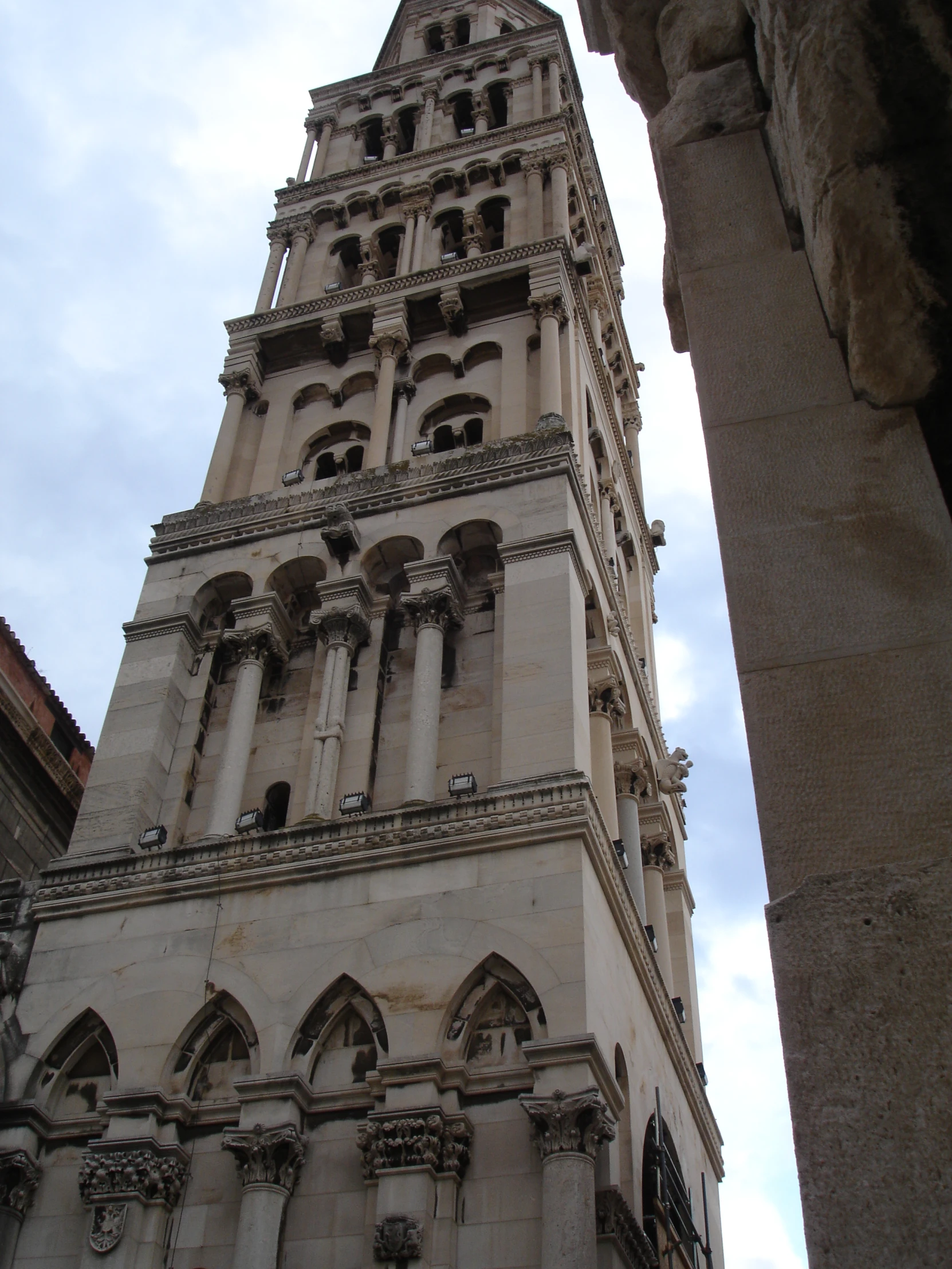 the large clock tower is situated high in the sky