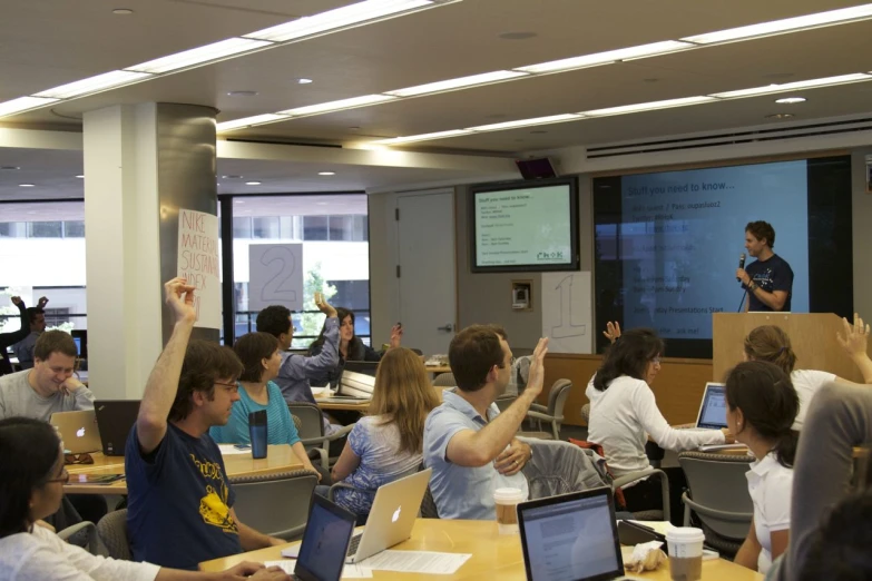 some students are sitting at their desks in class