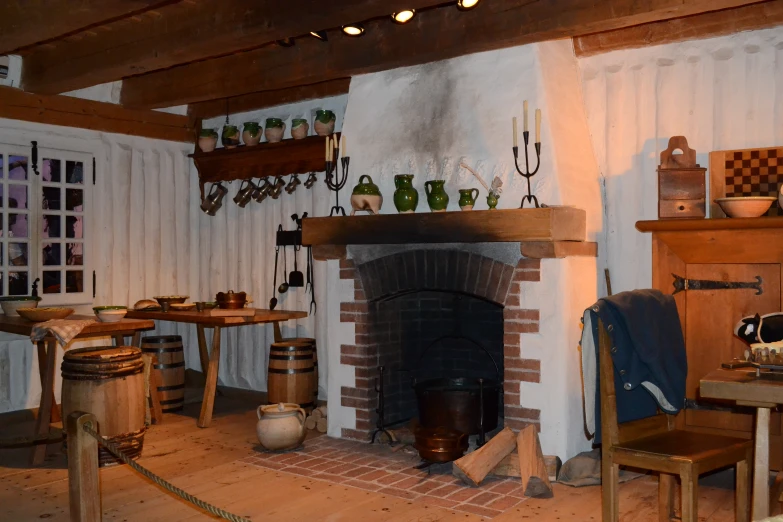 a room with a fire place and shelves with wine bottles on the wall