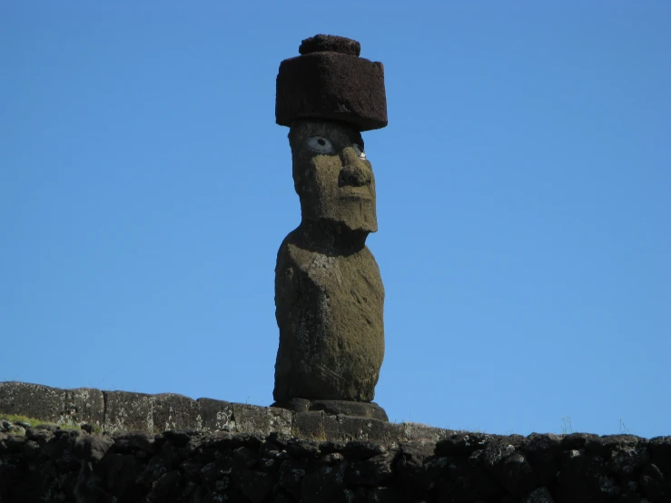 the large statue of the person is wearing a hat