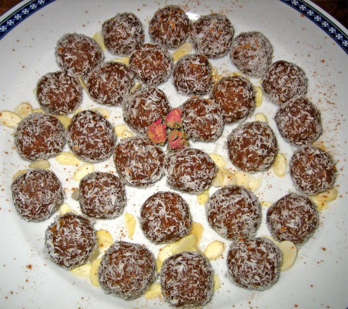 a plate of dark desserts arranged in a circle