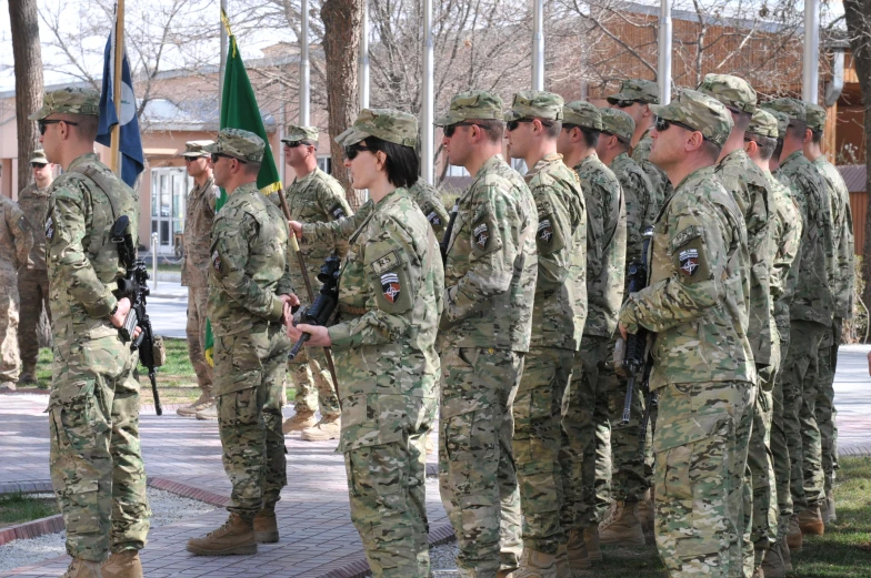 a group of army personnel standing next to each other