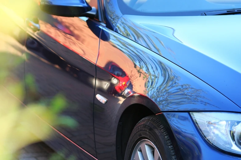 an older bmw vehicle with chrome ke covers