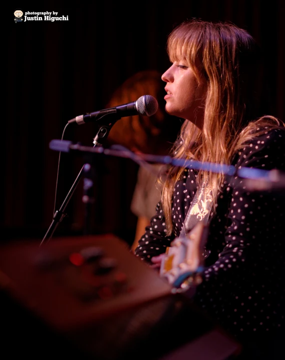 a person standing in front of a microphone