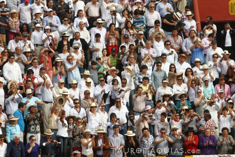 crowd of people are waiting at the tennis match