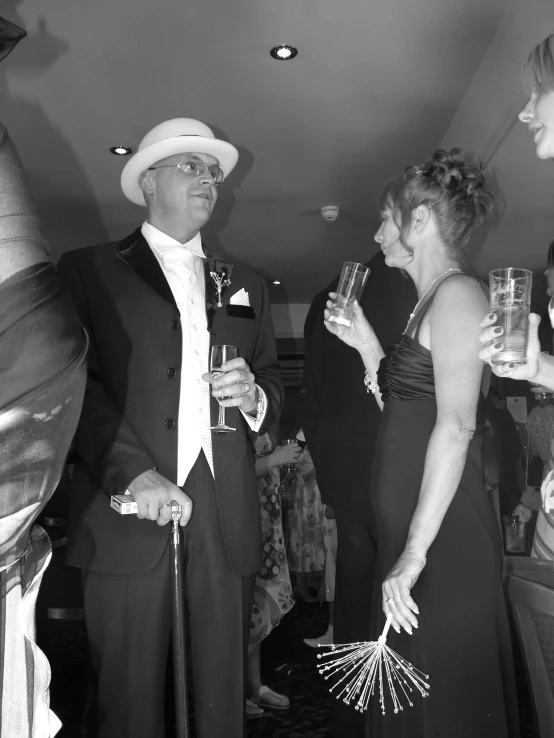 black and white po of two ladies wearing hats