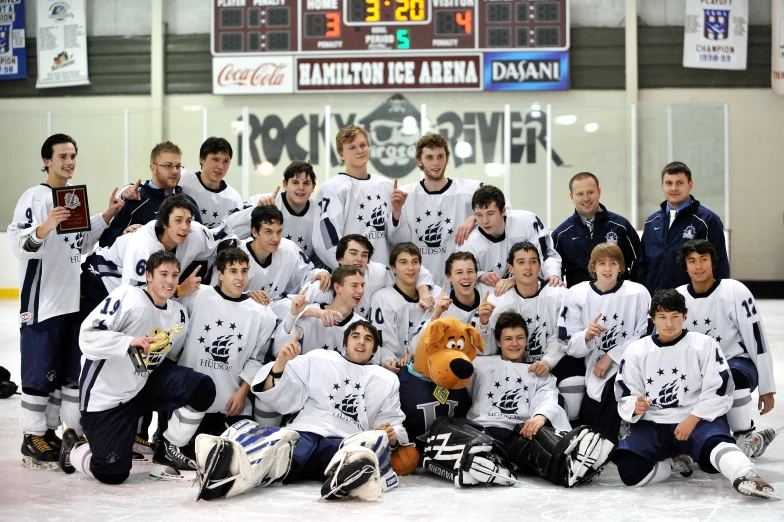 a hockey team celeting their state cup win