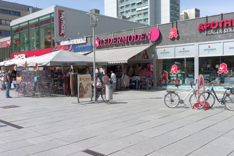 a small group of bicycles parked outside a store