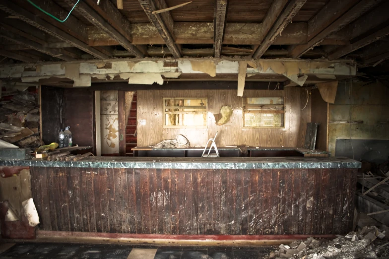 the inside of a building with exposed wood and debris